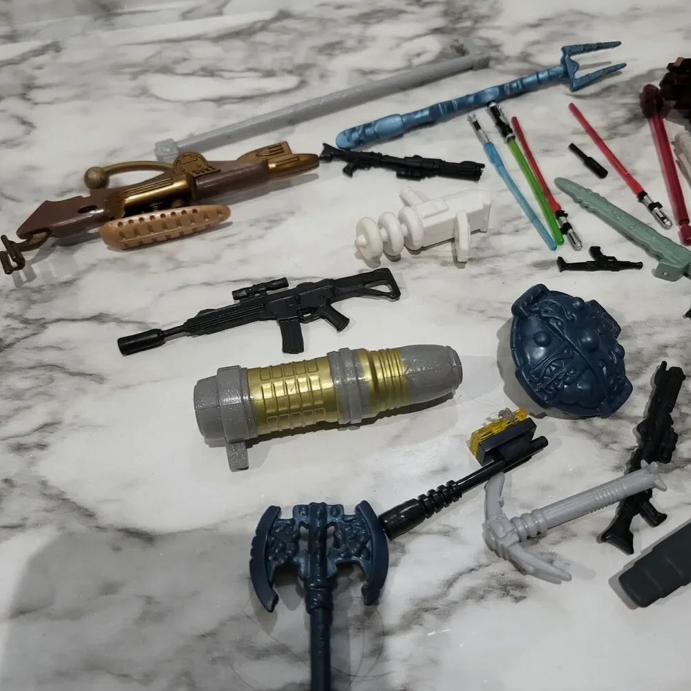 Assorted action figure weapons